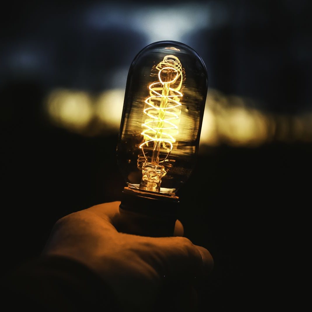 closeup-shot-human-hand-holding-lamp